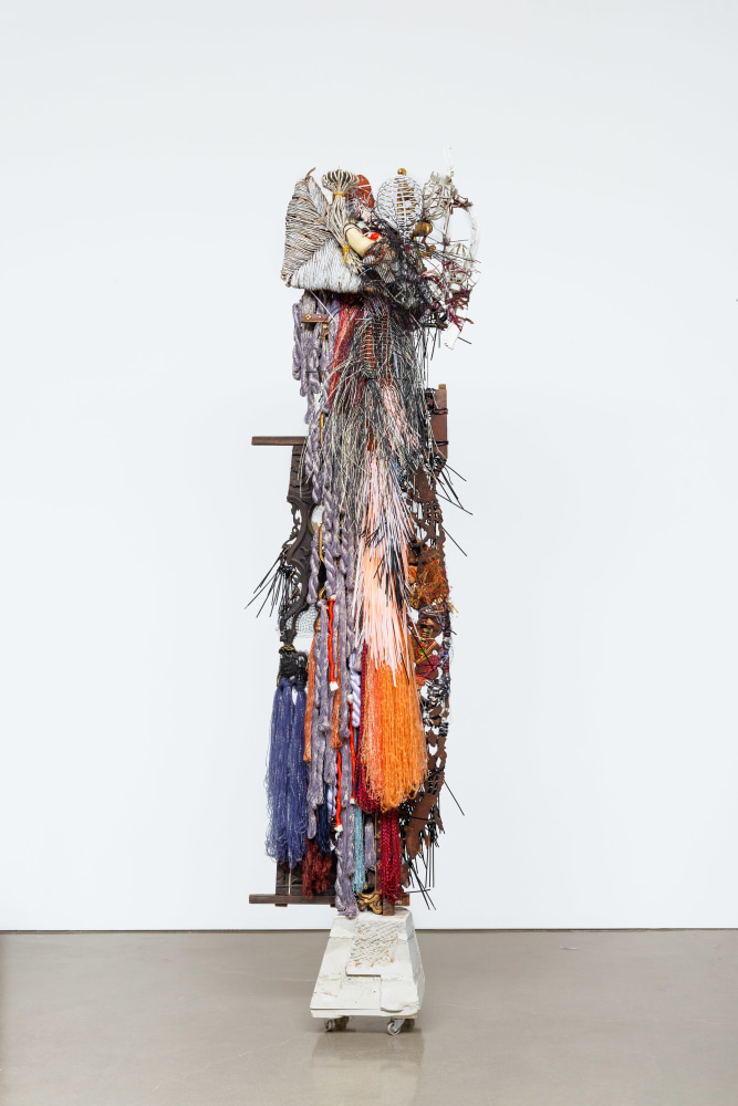 Elliott Hundley
Palette 2
2022
Wood, concrete, metal, plastic, wire, yarn, bamboo, fabric, feathers, glass, antler, horn
132 x 30 1/2 x 33 inches (335.3 x 77.5 x 83.8 cm)