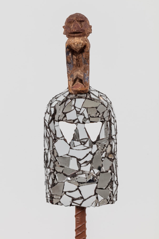 Kader Attia
Mirror Mask (detail)
2020
Wooden mask, mirror fragments, black pigment
Artwork Dimensions:
17 1/2 x 6 x 6 1/2 inches (44.5 x 15.2 x 16.5 cm)
Overall Dimensions:
75 1/4 x 10 x 10 inches (191.1 x 25.4 x 25.4 cm)
