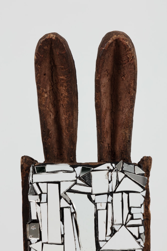 Kader Attia
Mirror Mask (detail)
2020
Wooden mask, mirror fragments, black pigment
Artwork Dimensions:
18 1/8 x 7 x 6 5/8 inches (46 x 18 x 17 cm)
Overall Dimensions:
77 x 10 x 10 inches (195.6 x 25.4 x 25.4 cm)