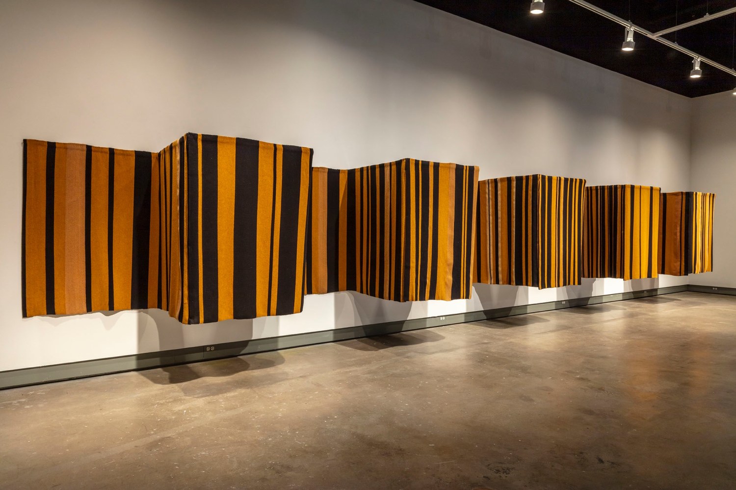 A-Z Cover Series 1 (Gold and Black Stripes)
2012
Woven wool and steel
Dimensions variable, 10 panels