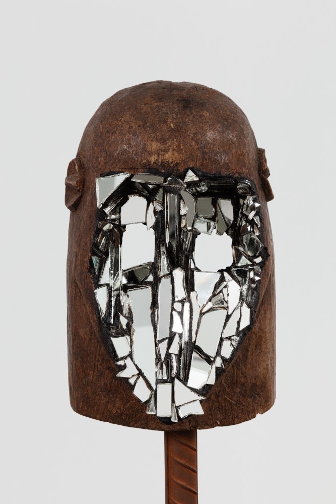 Kader Attia
Mirror Mask (detail)
2020
Wooden mask, mirror fragments, black pigment
Artwork Dimensions:
11 3/4 x 6 5/8 x 5 1/2 inches (30 x 17 x 14 cm)
Overall Dimensions:
70 x 10 x 10 inches (177.8 x 25.4 x 25.4 cm)