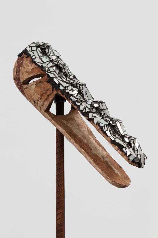 Kader Attia
Mirror Mask (detail)
2020
Wooden mask, mirror fragments, black pigment
Artwork Dimensions:
22 x 8 1/4 x 6 1/4 inches (56 x 21 x 15.8 cm)
Overall Dimensions:
70 x 8 1/4 x 10 inches (177.8 x 21 x 25.4 cm)