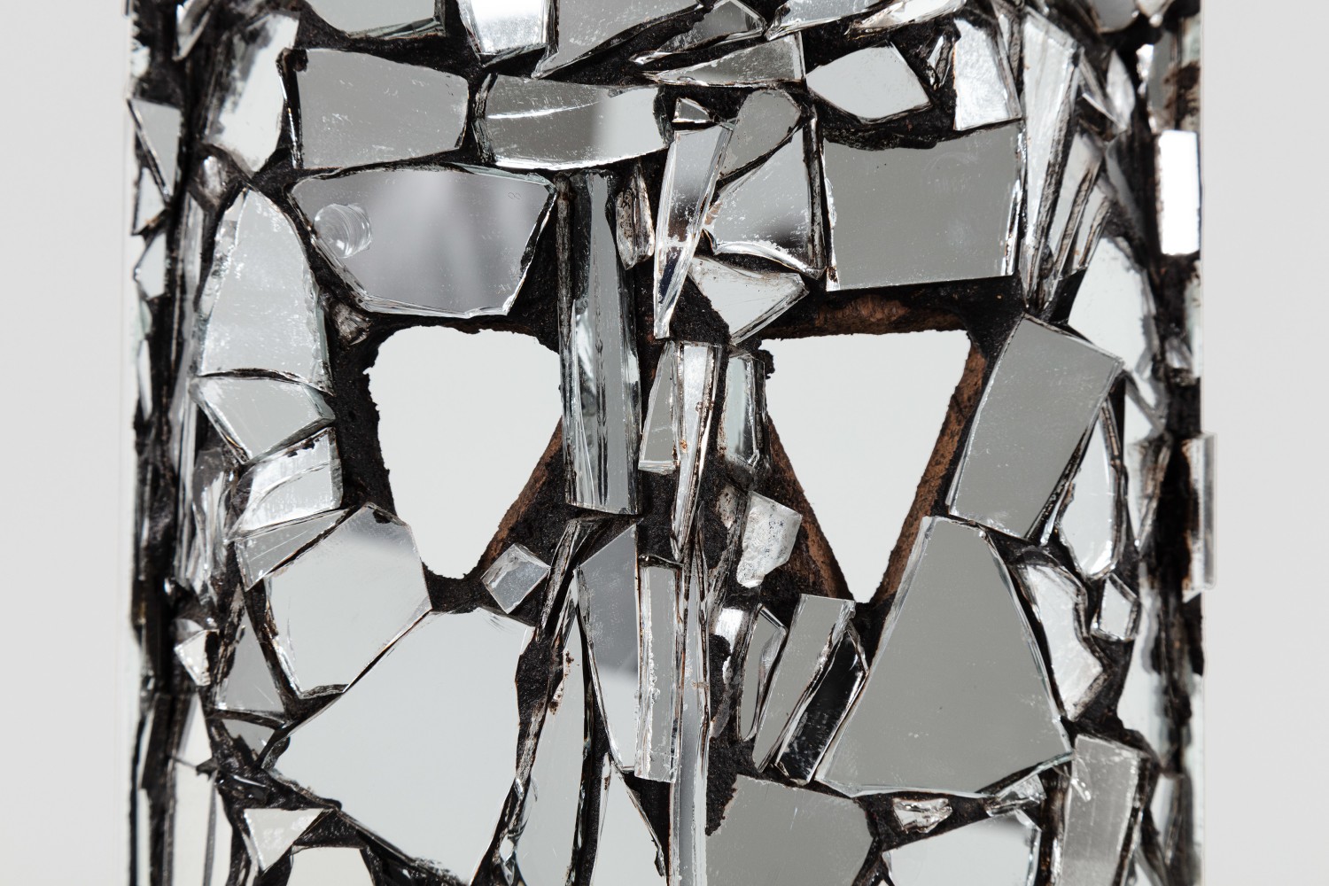 Kader Attia
Mirror Mask&amp;nbsp;(detail)
2020
Wooden mask, mirror fragments, black pigment
Artwork Dimensions:
21 1/4 x 6 x 4 3/4 inches (54 x 15 x 12 cm)
Overall Dimensions:
80 x 10 x 10 inches (203.2 x 25.4 x 25.4 cm)