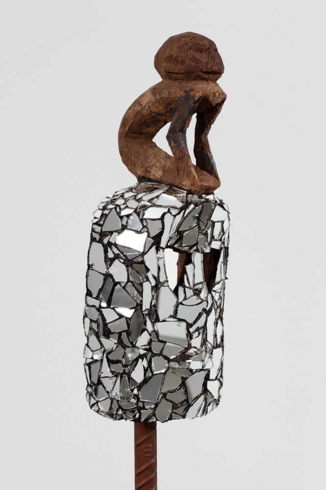 Kader Attia
Mirror Mask (detail)
2020
Wooden mask, mirror fragments, black pigment
Artwork Dimensions:
17 1/2 x 6 x 6 1/2 inches (44.5 x 15.2 x 16.5 cm)
Overall Dimensions:
75 1/4 x 10 x 10 inches (191.1 x 25.4 x 25.4 cm)