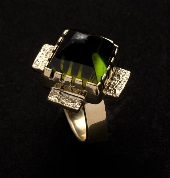​Ring, d. 2020, carved green tourmaline with tufa-cast flanges&amp;nbsp;(size 7-1/4),&amp;nbsp;OC311-151