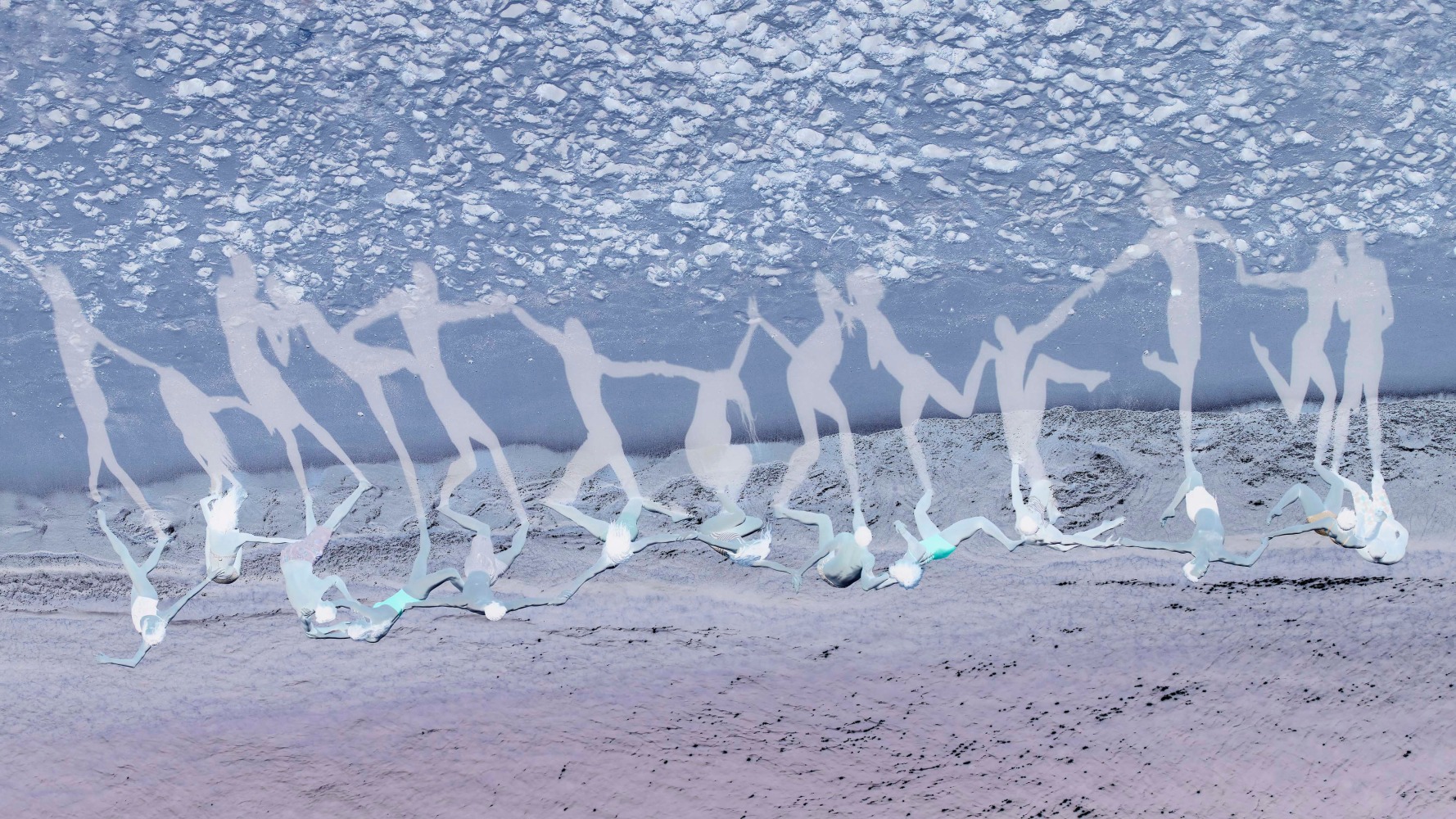 a reverse and flipped image of dancers on the beach