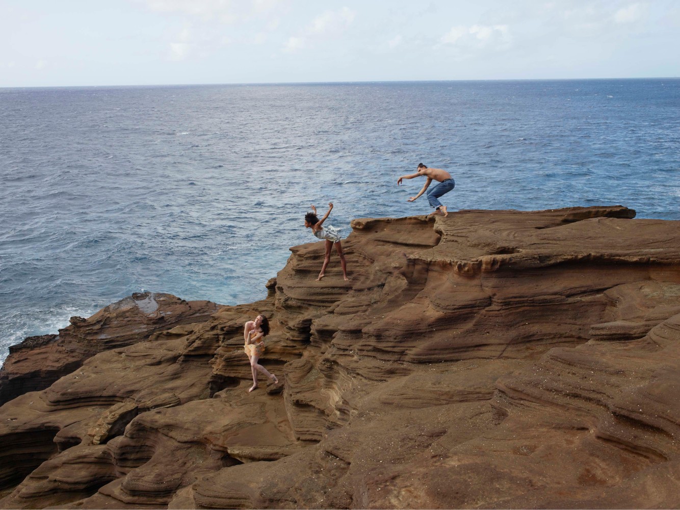 three dancers on the cliff