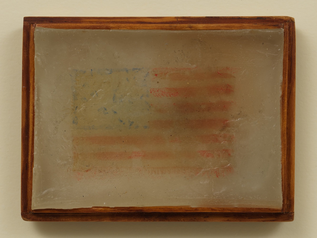 Jasper Johns (b. 1930)
Flag, 1958
Print silk covered with paraffin with wood frame
2 3/4 x 3 3/4 inches, including frame