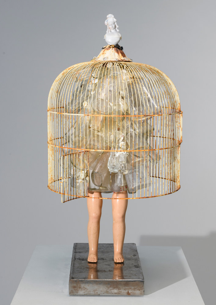 Karin Broker  Bottle Girl, 2022  metal, bottles, porcelain, buttons, wire, steel base  29 x 5 x 5 inches  $25,000