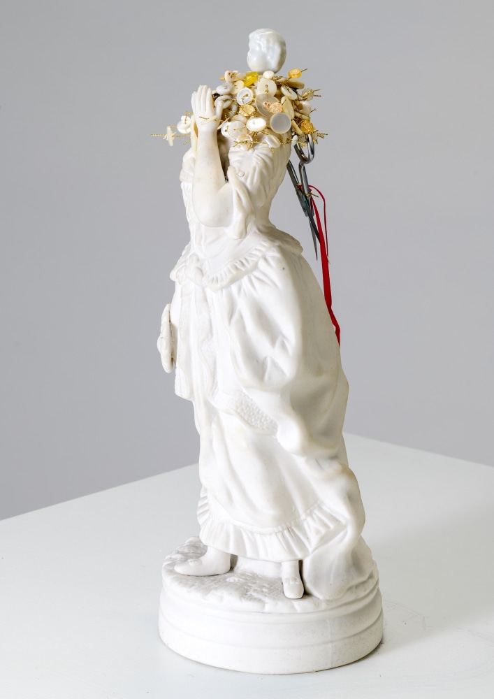 Karin Broker  Snippy girl, 2022  porcelain, scissors, buttons, wire, ribbon  13 1/4 x 5 x 5 inches  $12,000