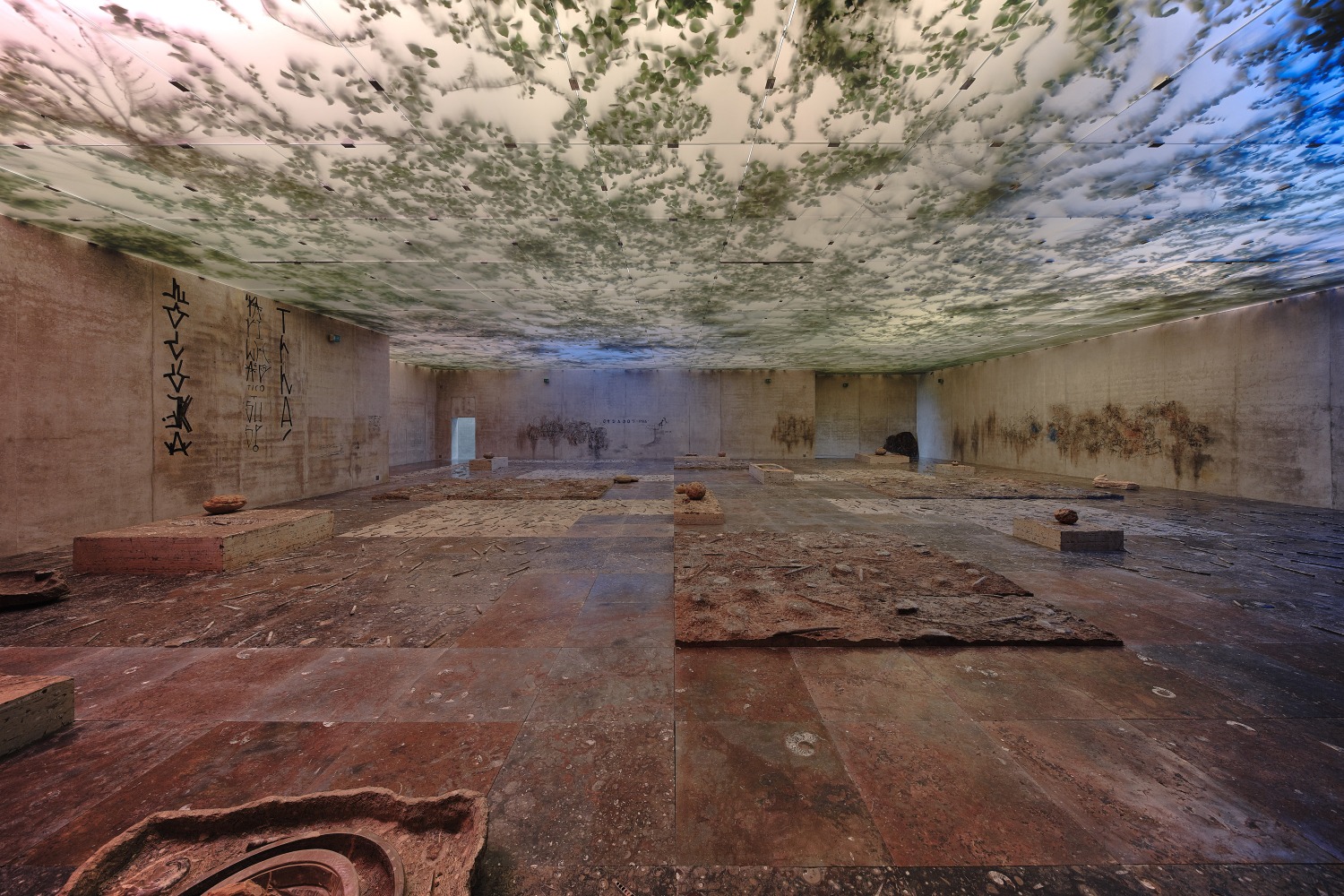 the theater of disappearance, 2017

ivy, coloured lights, recreations of parietal pictographs, pixacao and roman period graffiti, floor tiles and blocks of moroccan marble encrusted with ammonites and orthoceras fossils, fossilized turtle shells, neolithic stone tools, septarian concretions

on site installation

installation view of&amp;nbsp;adrián villar rojas: the theater of disappearance,&amp;nbsp;kunsthaus bregenz, austria, 2017&amp;nbsp;

&amp;nbsp;