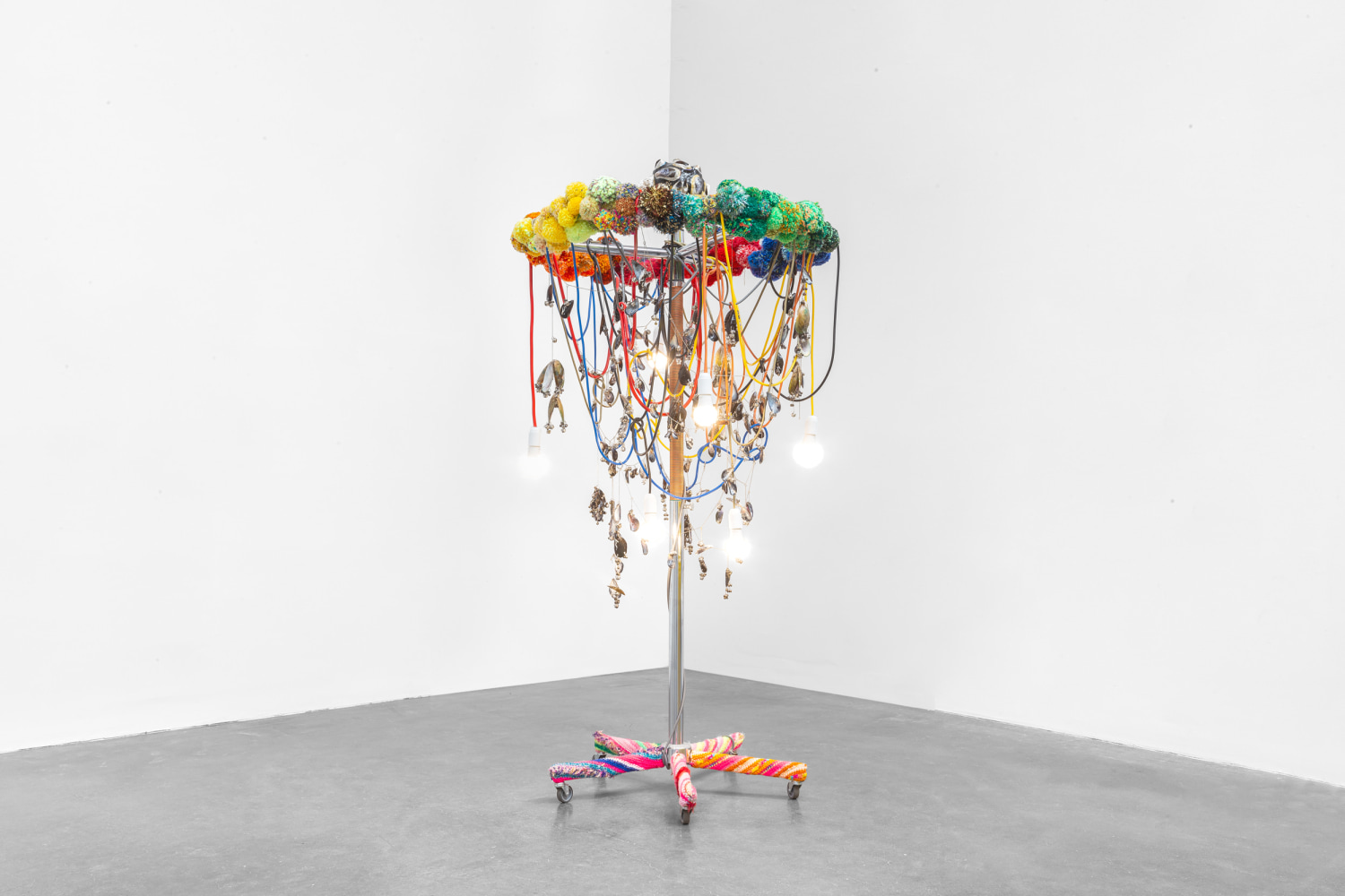 rainbow out of the water, 2012, clothing rack, casters light bulbs, cable, zip ties, terminal strips, nylon cord, knitting yarn, seashells, metal chains, metal rings, bells, papier-m&amp;acirc;ch&amp;eacute;, watercolor, varnish, 70.87 x 40.16 x 40.16 in