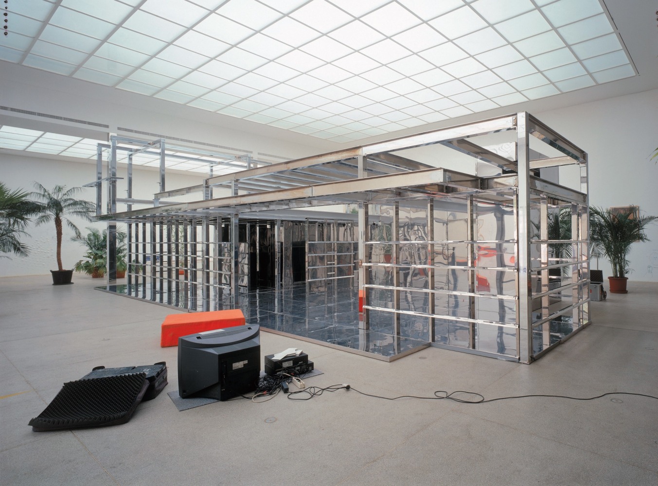 untitled 2002 (he promised), 2002
chrome and stainless steel, monitors, palms
variable dimensions

&amp;nbsp;