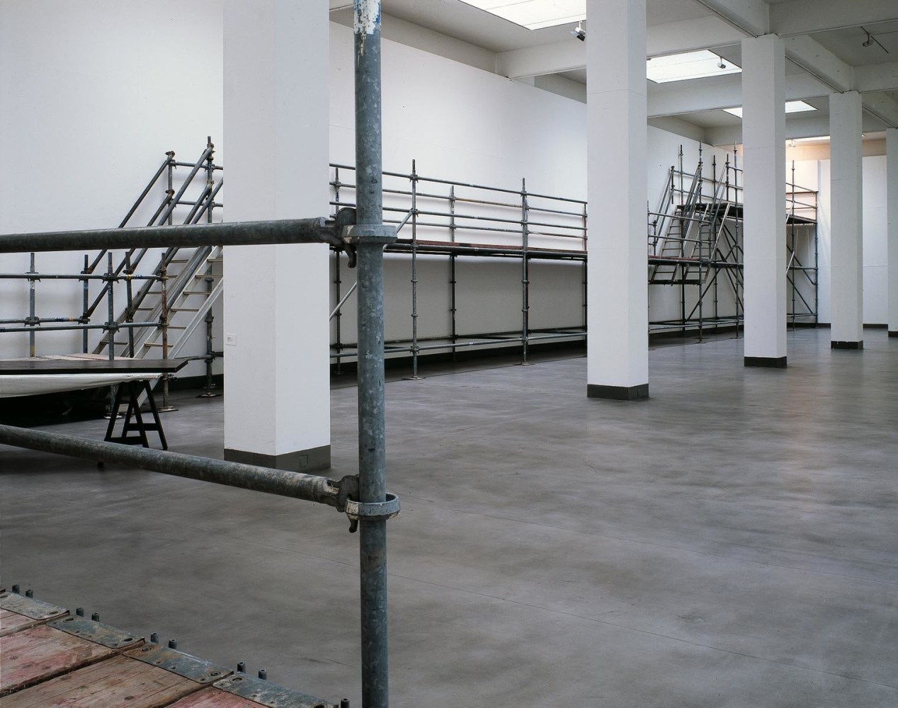 seconds after the dive, 2005

scaffolding and framed postcard at the end of the trail

scaffolding: variable dimensions

&amp;nbsp;

&amp;nbsp;