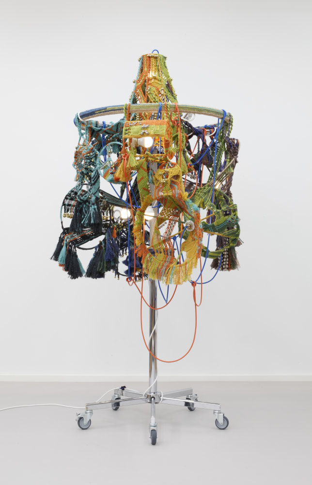 ceremonial fanfare in dual tones, 2015
clothing rack, jute twine, knitting yarn, lampshade frames, brass plated bells, nickel plated bells, metal rings, light bulbs, cord, cable, cable ties, casters

81.89 x 39.76 x 44.09 in.