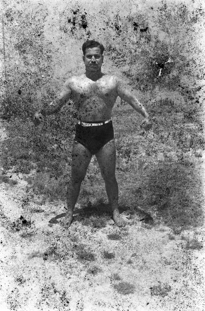 bodybuilders. printed from a damaged negative showing hassan el aakkad in saida, 1948, 2007

inkjet print

70.87 x 57.09 in.