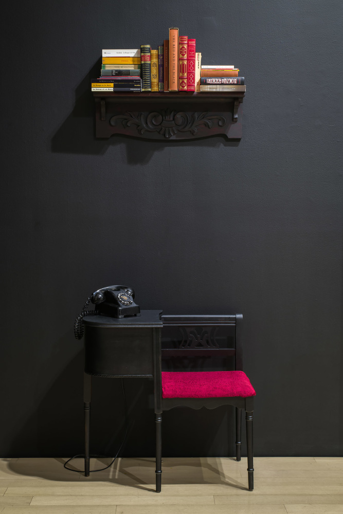 The Red and the Black, 2021&amp;nbsp;
Vintage telephone, chair, shelf, and books&amp;nbsp;
Excerpts from Stendhal&amp;rsquo;s The Red and the Black, read by Alva Rogers, lyrics from Jacques Brel&amp;rsquo;s song &amp;ldquo;Ne Me Quitte Pas,&amp;rdquo; spoken by Joyce Bukuru, and excerpts from Stendal&amp;rsquo;s The Red and the Black, read in French by Catherine Bengu&amp;nbsp;
81 x 28 x 17 inches&amp;nbsp;