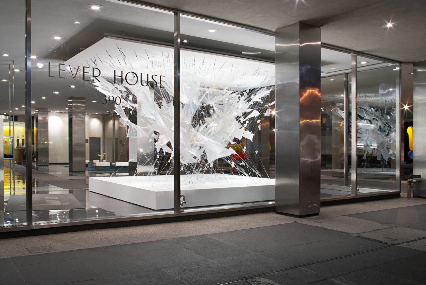 View of "Bride Fight" from outside of the Lever House lobby. 