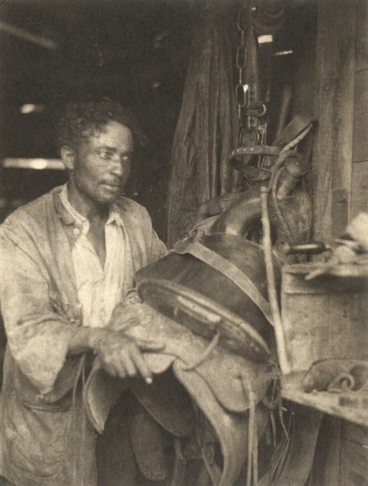 Doris ULMANN (American, 1882-1934) Man with a saddle, circa 1920s, Platinum print 20.4 x 15.4 cm