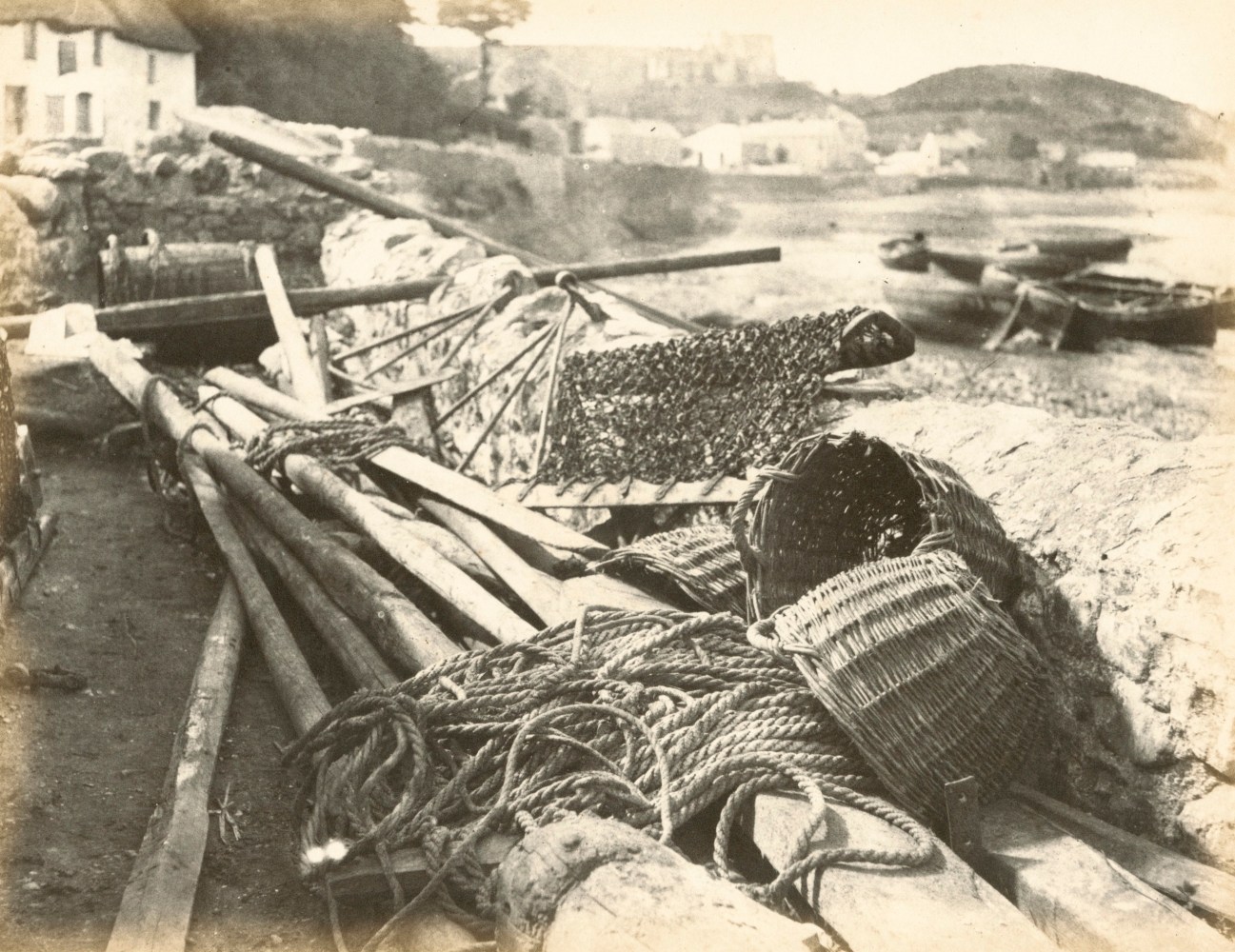 Hugh OWEN (English, 1808-1897) Dredges and baskets at Oystermouth, The Gower Albumen print, 1860s-1870s, from a paper negative, before 1855 17.3 x 22.4 cm mounted on 26.0 x 28.3 cm album sheet Numbered &quot;71&quot; in pencil on mount