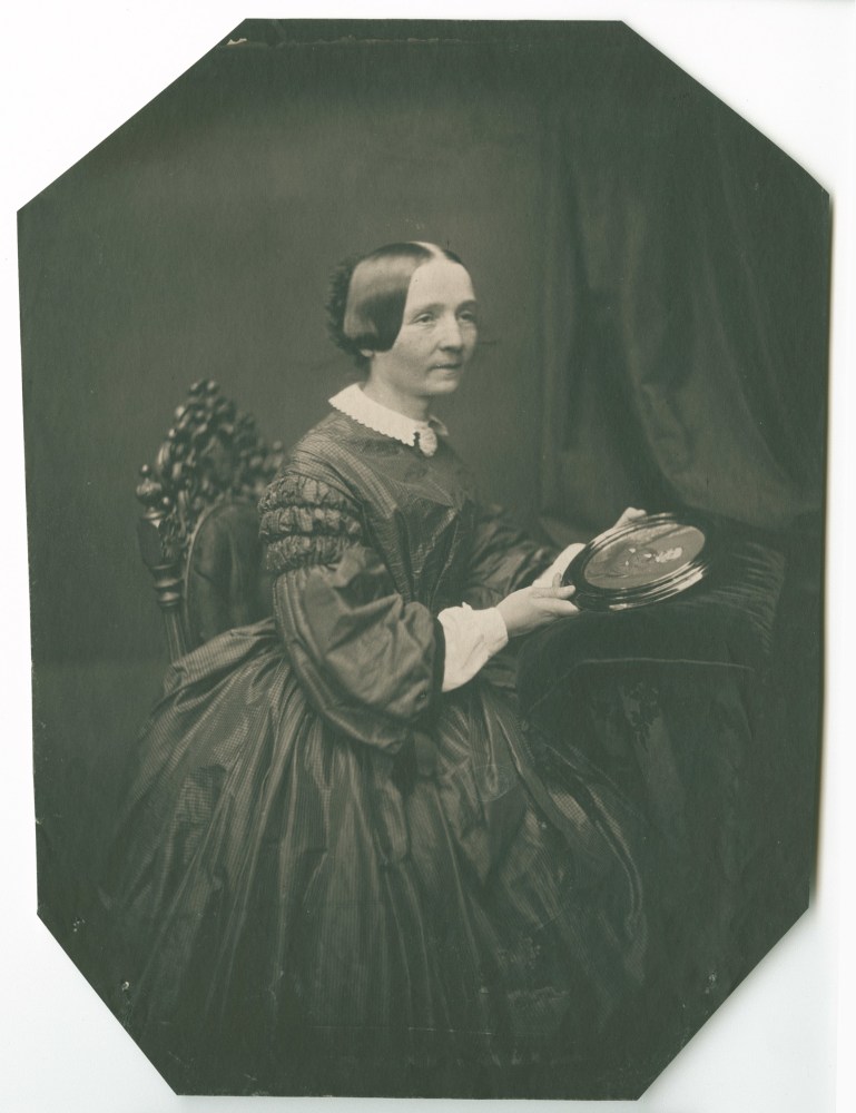 Bertha Wehnert-Beckmann (German, 1815-1901) Portrait of woman holding a framed photograph, circa 1850s-1860s, Salt print from a collodion negative 22.6 x 16.9 cm