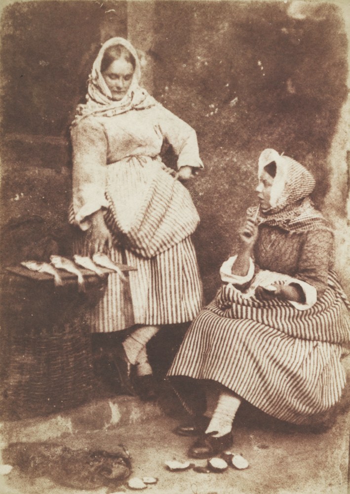 David Octavius HILL &amp; Robert ADAMSON (Scottish, 1802-1870 &amp; 1821-1848) Jeanie Wilson and Annie Linton, Newhaven, &quot;They were twa bonnie lasses&quot;, circa 1845 Salt print from a calotype negative 19.0 x 13.6 cm mounted on 37.4 x 26.2 cm grey paper &quot;58&quot; noted in pencil on mount verso