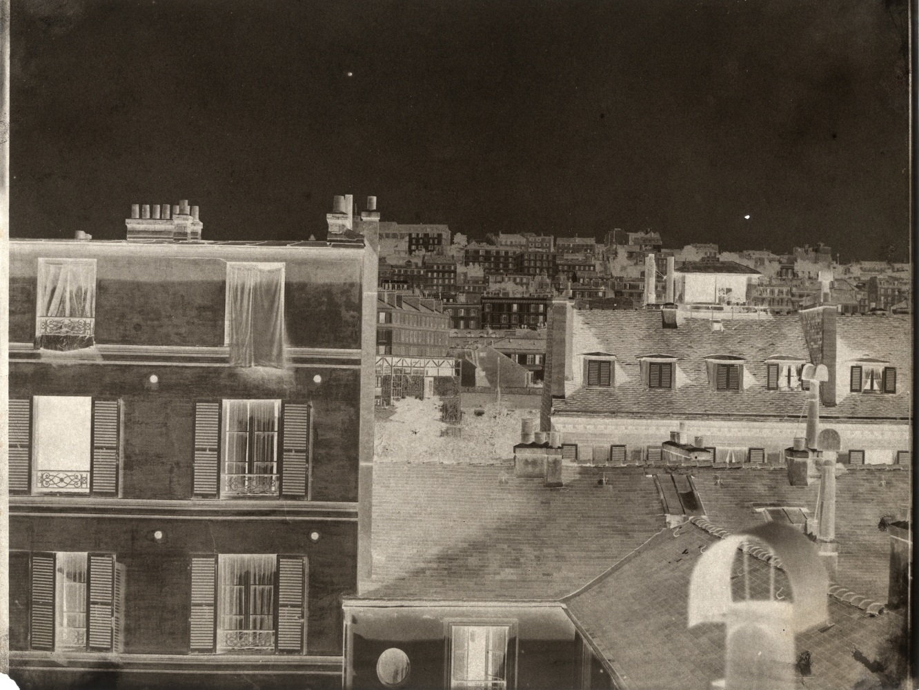 John Beasley GREENE (American, born in France, 1832-1856) Rooftops, Paris, 1852-1853 or earlier Waxed paper negative 24.3 x 31.2 cm