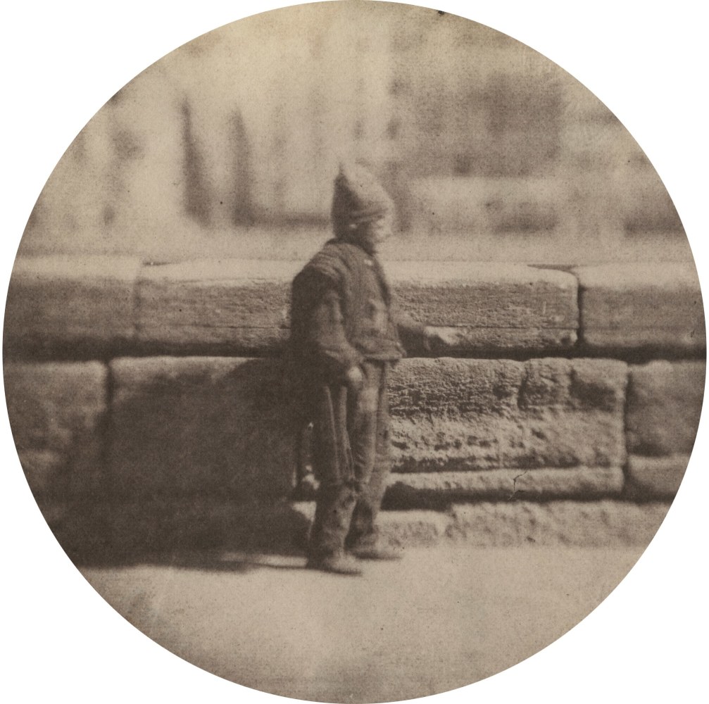 Charles NÈGRE (French, 1820-1880) Le petit ramoneur, December 1851 Salt print from a waxed paper negative with selectively applied graphite 8.7 cm tondo Blindstamp &quot;Canson&quot;