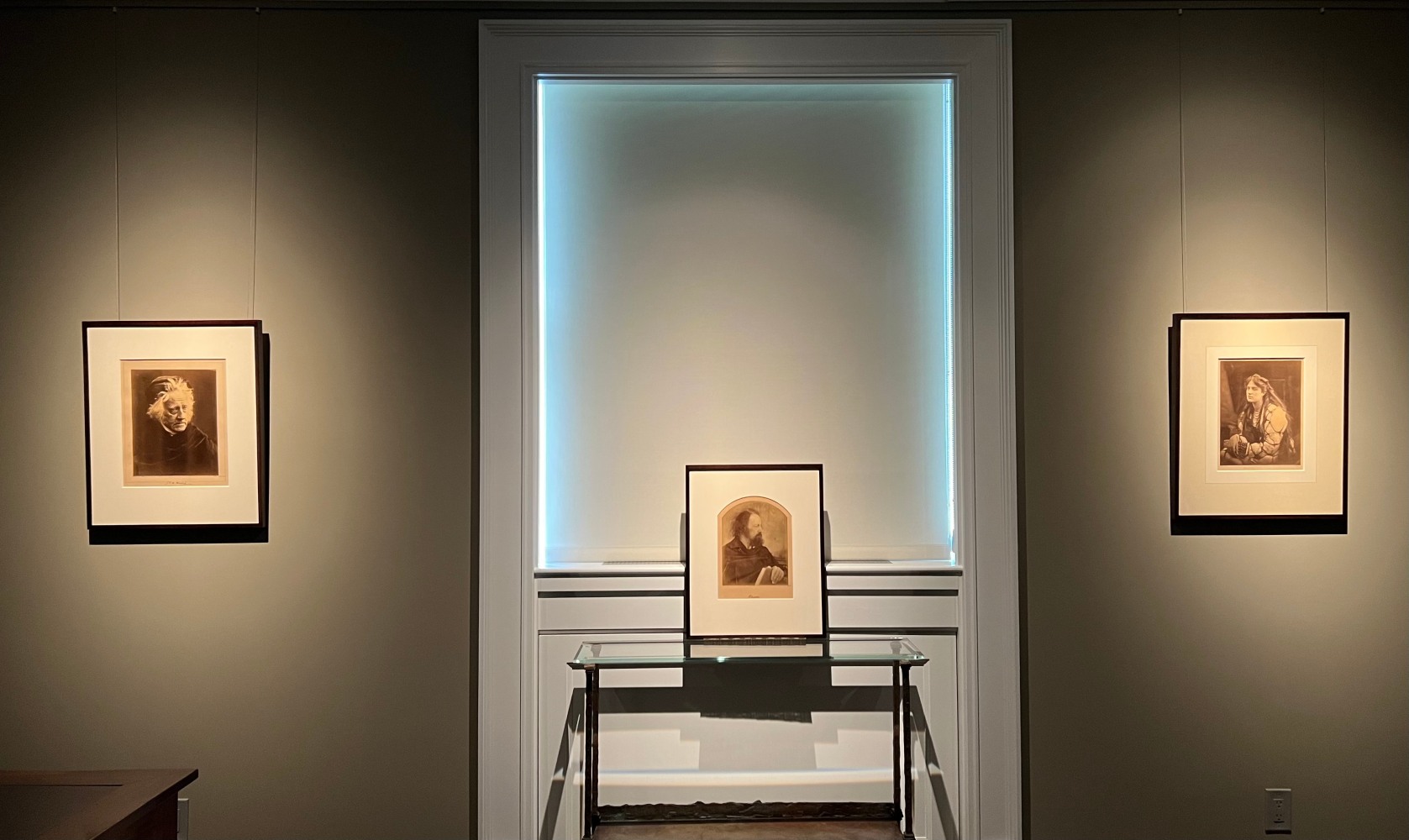 Second installation view of exhibition, 3 portraits by Julia Margaret Cameron of Herschel, Tennyson and Marie Spartali