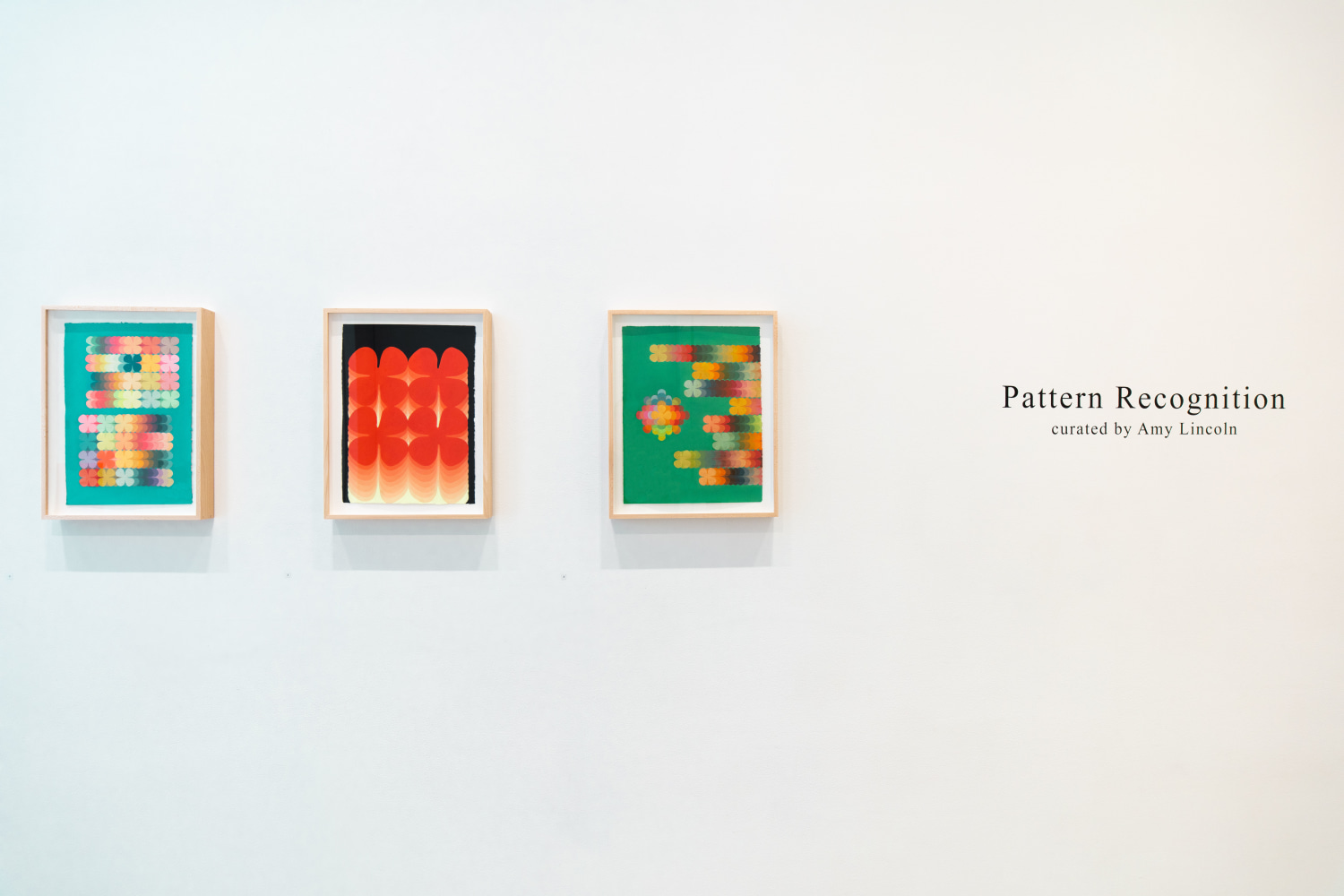 colorful abstract paintings hang in art gallery