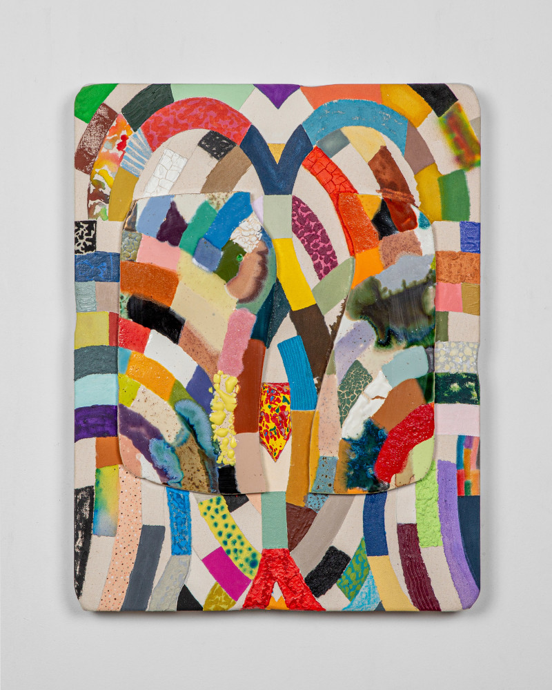 colorful painted canvas with fragments of glazed ceramics attached