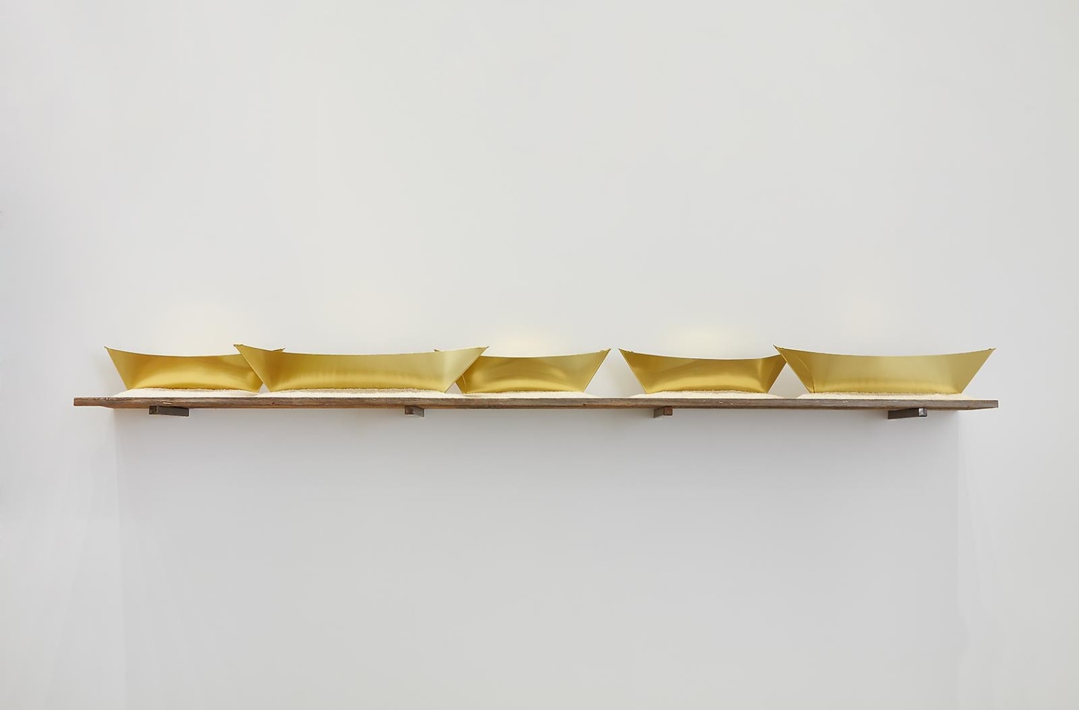 Wolfgang Laib
Passageway, 2013
5 brass ships, rice, wood and steel
6 3/4 x 103 x 12 inches (17,2 x 262 x 30,5 cm) overall
SW 13141