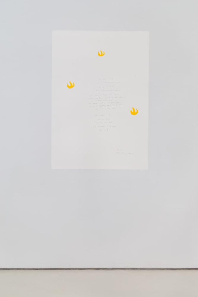 Wall painting with white background, yellow shapes, and taoist poem handwritten