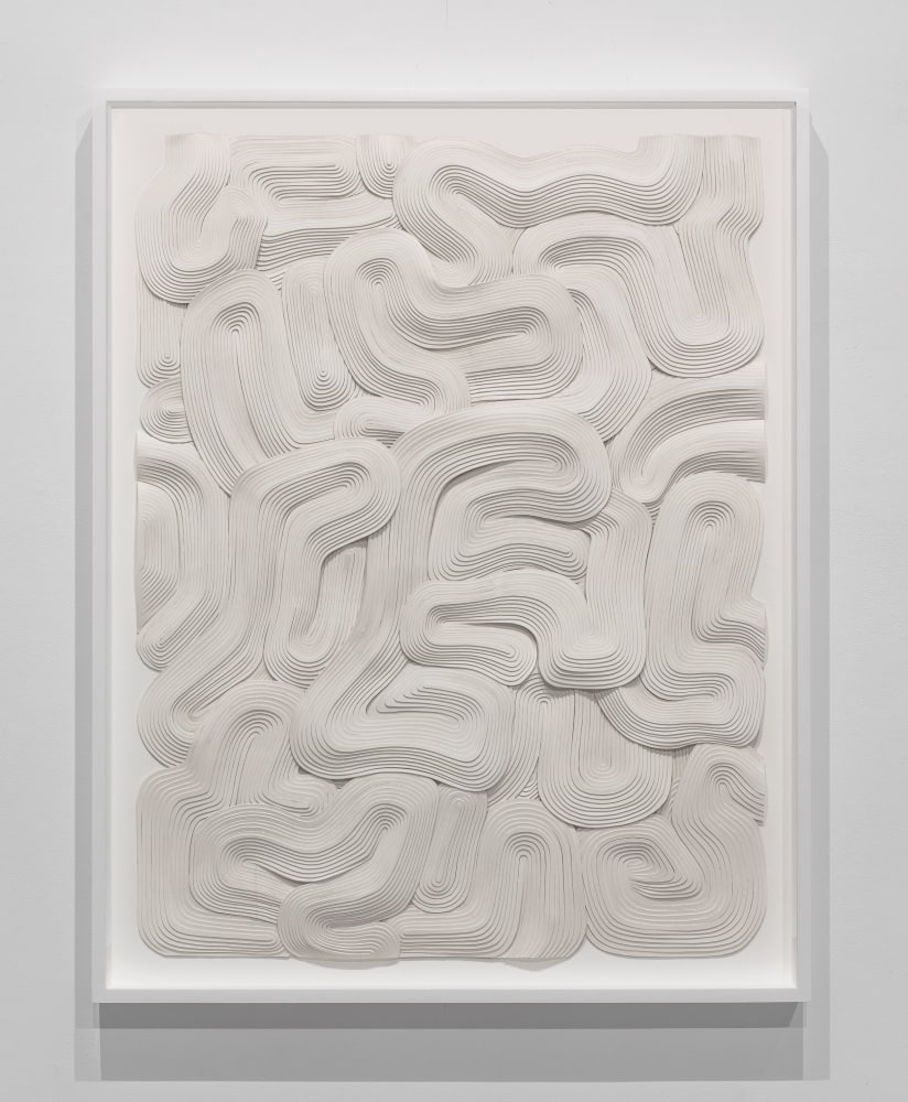 cream-colored monochromatic bas-relief with abstract geometric and organic forms