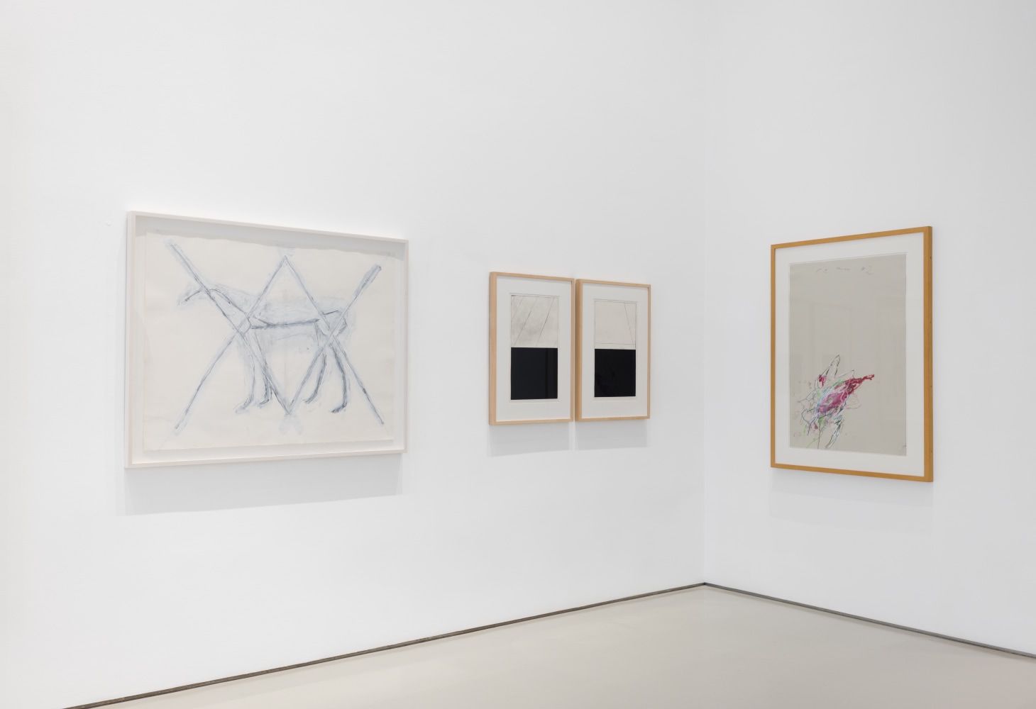 opposite corner of gallery pictured with four framed artworks