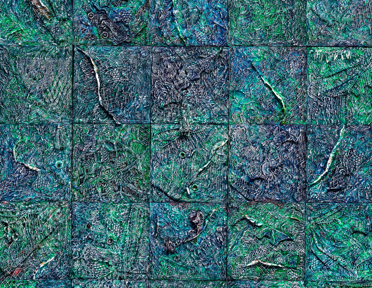 Close-up detail of textured green and blue artwork