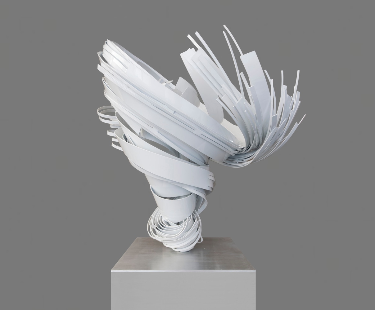 White powder coated aluminum sculpture of a small twist by Alice Aycock