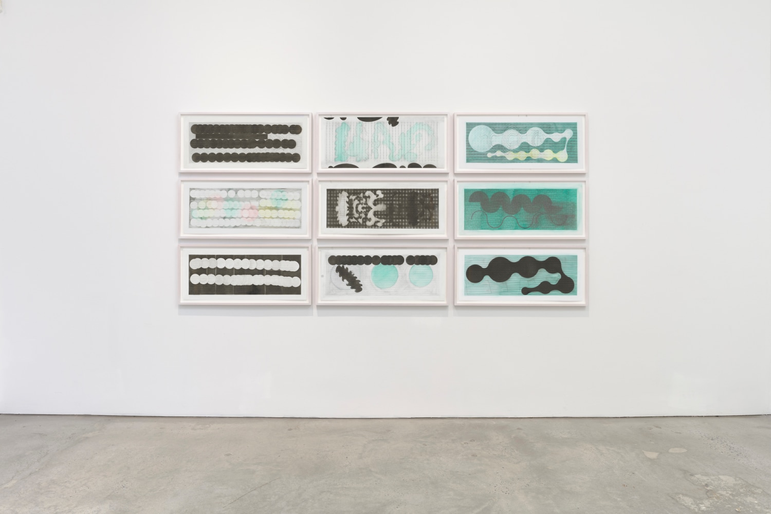 Installation view of several mixed media works by Gustavo Pérez Monzón