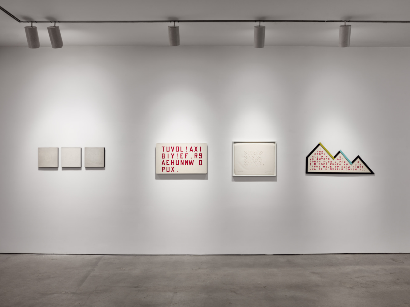 Installation view of &quot;Schema World as Diagram&quot; featuring four works on a gray wall.