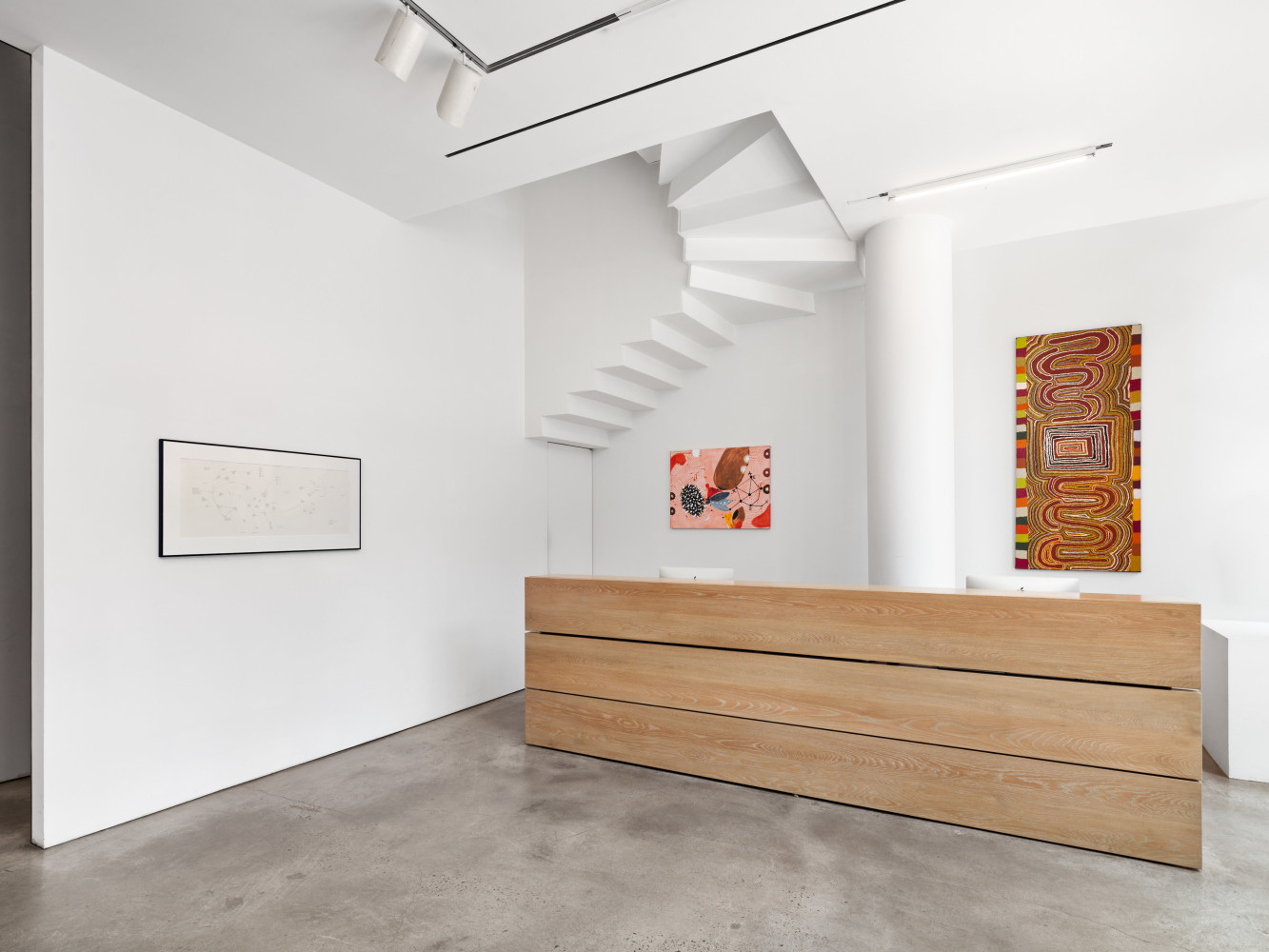 Installation view of &quot;Schema World as Diagram&quot; featuring three works above the front desk.