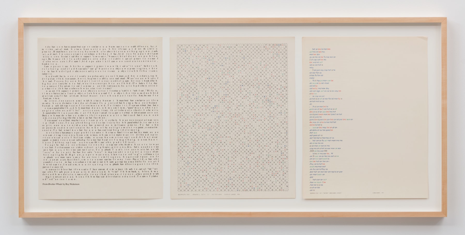 Three sheets of text displayed in a wooden frame.