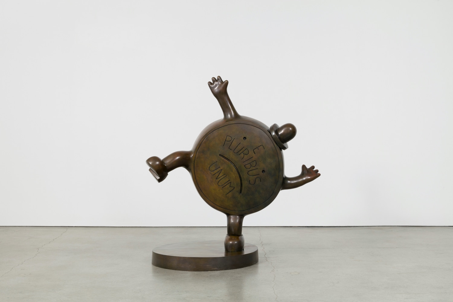 Bronze sculpture of a personified penny coin with top hat by Tom Otterness.