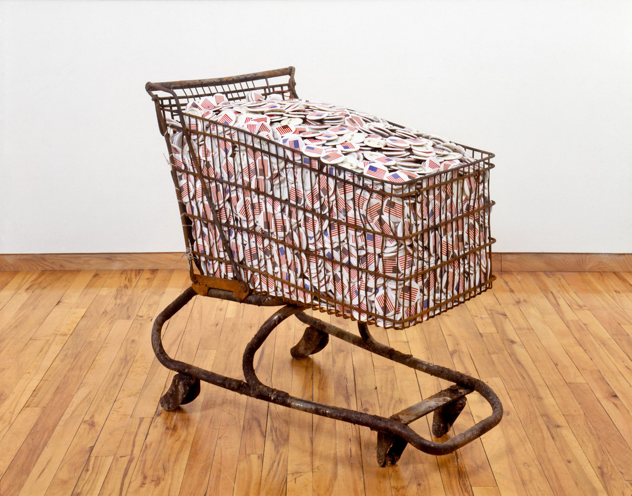 Hans Haacke Collateral, 1991 shopping cart with silkscreened metal buttons 33 x 37 1/2 x 20 1/2 in (83.8 x 95.3 x 52.1 cm)