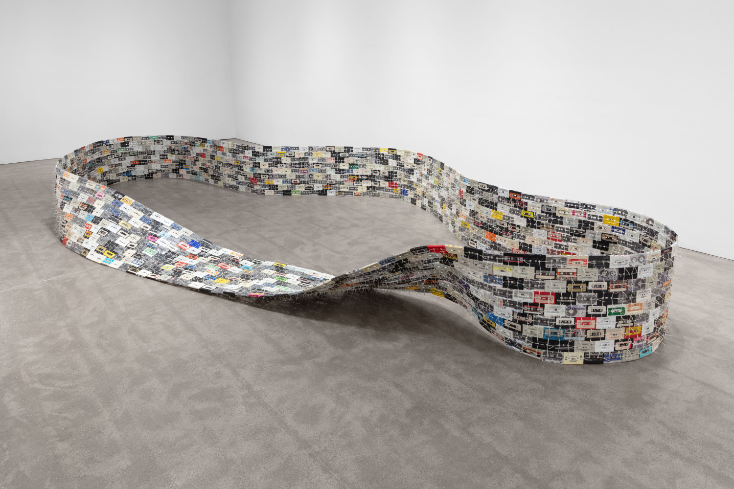 Christian Marclay, Moebius Loop, 1994, cassette tapes, nylon ties 24 x 84 x 240 inches (61 x 213.4 x 609.6 cm)