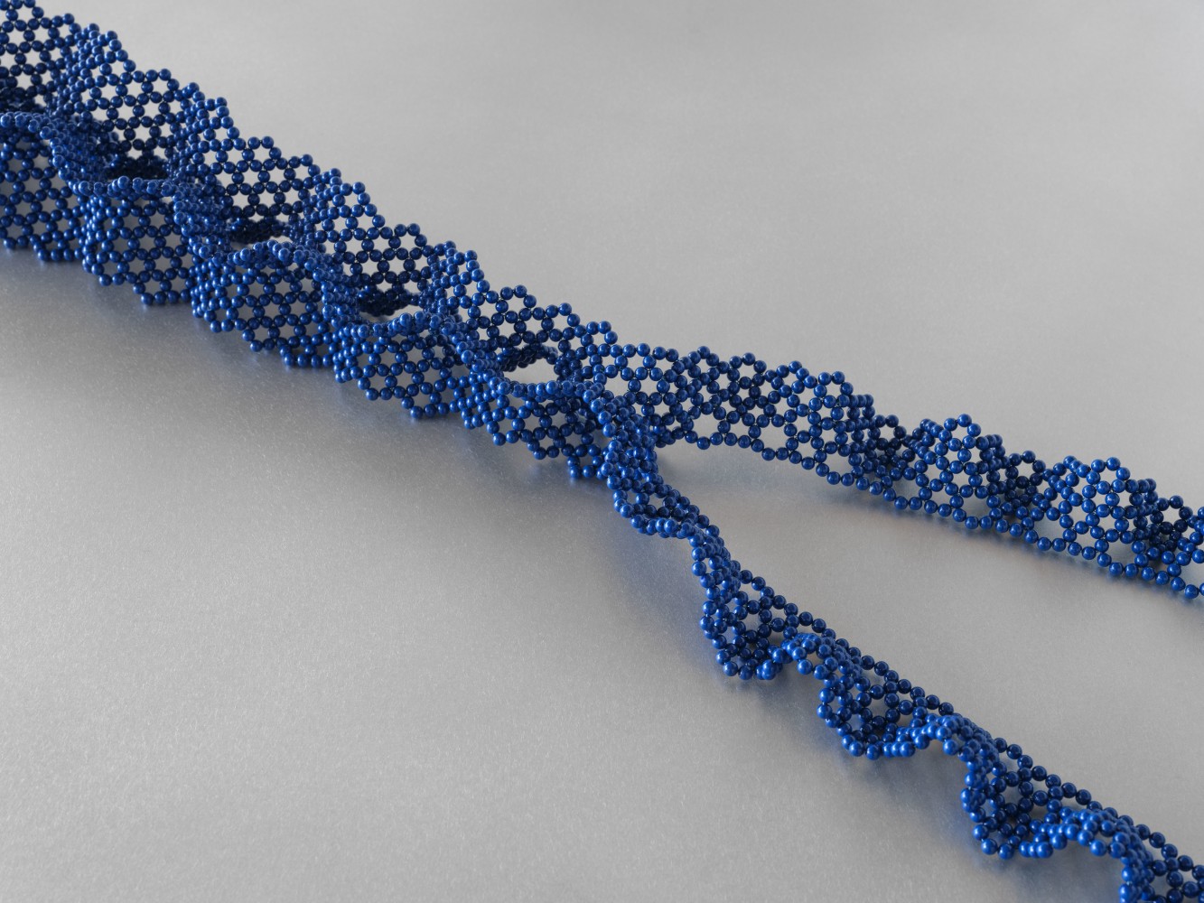 Tauba Auerbach 
Org, 2023
woven glass beads
5 x 70 1/2 x 23 in. (12.7 x 179.1 x 58.4 cm)