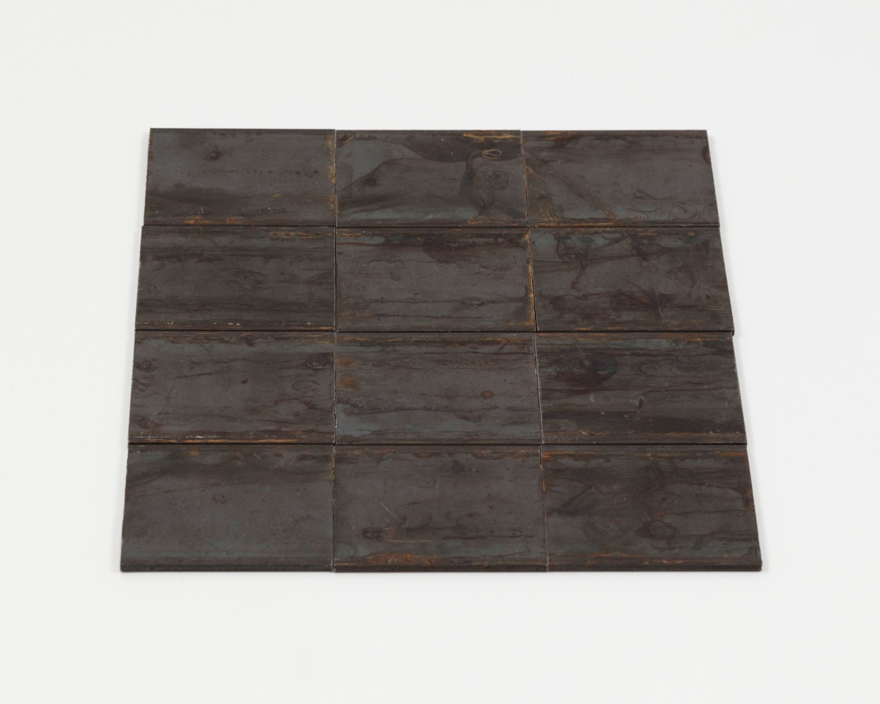 Carl Andre Steelyard, New York 1975 hot-rolled steel, 12-unit rectangle (3 x 4) on the floor each: 1/8 x 2 1/2 x 2 in. (.3 x 6.4 x 5.1 cm) overall: 1/8 x 7 1/2 x 8 in. (.3 x 19.1 x 20.3 cm)