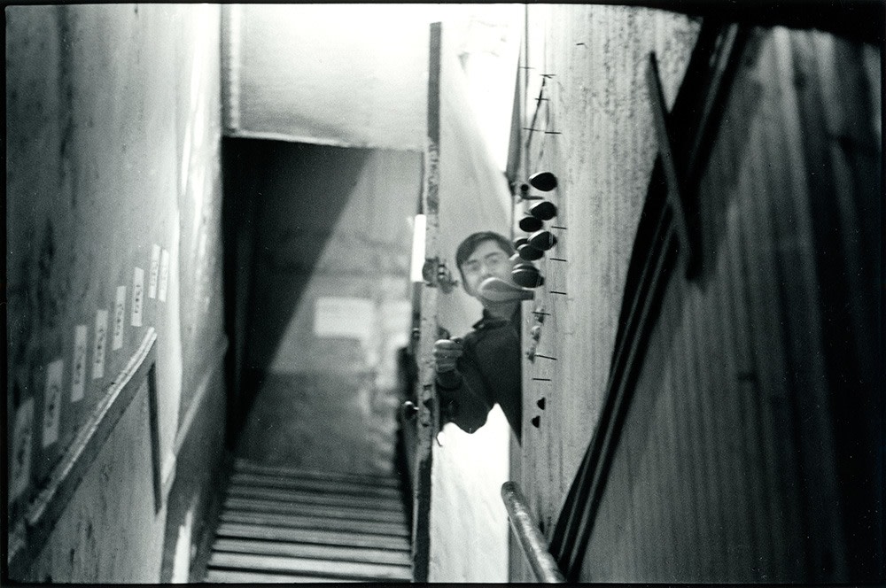 Peter Moore "George Maciunas & doorbell, Fluxhall/Fluxshop, 359 Canal Street, NY" June 1, 1964 Gelatin silver print 8 x 10 in.