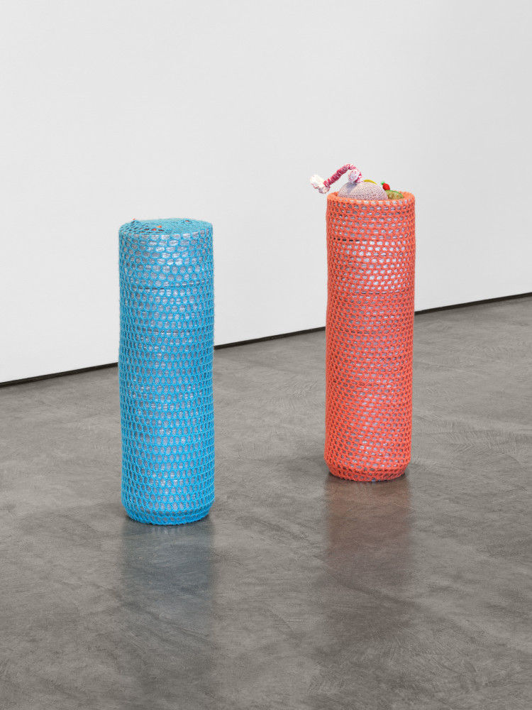 Veronica Ryan Totem, 2024–2025 pie tins, crochet wool, plaster, thread, Himalayan salt, netting, thread, air-dried clay, acrylic paint pink totem: 35 x 12 x 9 1/2 in. (88.9 x 30.5 x 24.1 cm) blue totem: 30 1/4 x 9 1/4 x 9 1/4 in. (76.8 x 23.5 x 23.5 cm)