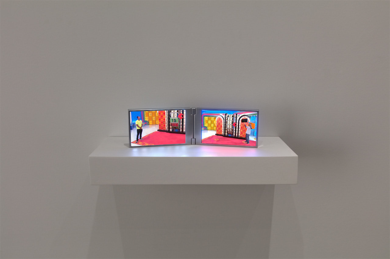 Paul Pfeiffer 
Desiderata (Big Wheel), 2019
digital video loops, fabricated aluminum monitor with two embedded media players
4 5/16 x 13 3/8 x 4 3/4 in (11 x 34 x 12 cm)
running time: 1 minute 30 seconds