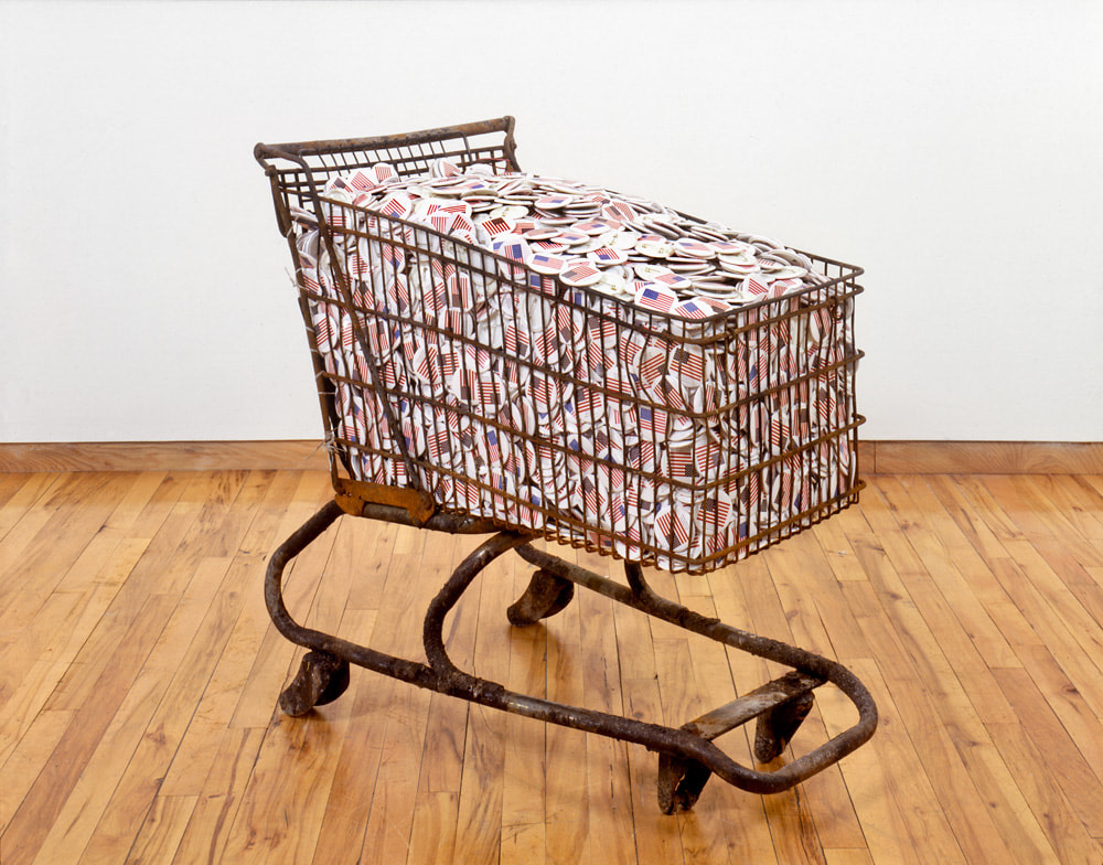 Hans Haacke "Collateral" 1991 Shopping cart with silkscreened metal buttons 33 x 37 1/2 x 20 1/2 in.